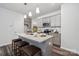 Kitchen island has granite countertop and stainless sink, as well as seating at 4754 Lakeview N Rd # 19, Charlotte, NC 28216