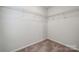 Empty walk-in closet with wire shelving and neutral carpet at 4754 Lakeview N Rd # 19, Charlotte, NC 28216
