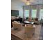 Bright living room with large windows, comfortable seating, and contemporary decor at 5103 Orchardview Way # 27, Charlotte, NC 28216