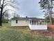Rear exterior of home with a screened-in porch at 512 Hall St, Salisbury, NC 28144