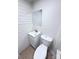 This bathroom features a pedestal sink, a toilet, and tiled floors at 512 Hall St, Salisbury, NC 28144