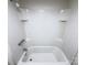 Close-up of a clean and modern shower-tub combo featuring tile surround and stainless steel fixtures at 512 Hall St, Salisbury, NC 28144