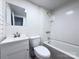 Bathroom features a shower-tub combo with tile surround, vanity with storage, and a toilet at 512 Hall St, Salisbury, NC 28144