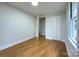 This bedroom features hardwood floors, neutral paint, natural light, and closet space at 512 Hall St, Salisbury, NC 28144
