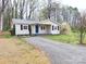 Charming single story home with black shutters and a gravel driveway at 512 Hall St, Salisbury, NC 28144