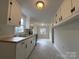 Bright kitchen featuring white cabinets, modern appliances, and wood countertops at 512 Hall St, Salisbury, NC 28144