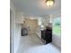 Bright kitchen featuring white cabinets, modern appliances, and wood countertops at 512 Hall St, Salisbury, NC 28144