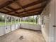 Inviting screened porch with rustic ceiling, ideal for enjoying views of the spacious backyard at 512 Hall St, Salisbury, NC 28144