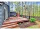 Inviting back deck with outdoor seating, plants and backyard at 6500 Wealdstone Ct, Mint Hill, NC 28227