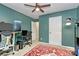 Bedroom with green walls, ceiling fan, a comfortable workspace, and a closet at 6500 Wealdstone Ct, Mint Hill, NC 28227