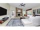 Spacious living room with stone fireplace, neutral colors, and lots of natural light at 6500 Wealdstone Ct, Mint Hill, NC 28227