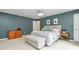 Serene main bedroom with calm blue walls, neutral furniture, and ensuite bathroom at 6500 Wealdstone Ct, Mint Hill, NC 28227