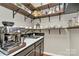 Butler's pantry featuring custom shelving, white countertops, and modern cabinets at 6500 Wealdstone Ct, Mint Hill, NC 28227