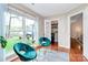 Bright sitting area offering views of the outdoors and access to a butler's pantry at 6500 Wealdstone Ct, Mint Hill, NC 28227