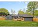 A well-maintained backyard featuring a deck and a charming shed for extra storage and outdoor enjoyment at 7009 Wrentree Dr, Charlotte, NC 28210