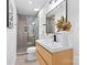 Modern bathroom features glass shower, sleek vanity, and neutral color palette at 7009 Wrentree Dr, Charlotte, NC 28210