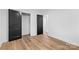 Bright bedroom features wood floors, closet and ensuite bathroom access at 7009 Wrentree Dr, Charlotte, NC 28210