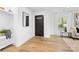 Inviting entryway features a stylish mirror, shelving, and natural light at 7009 Wrentree Dr, Charlotte, NC 28210