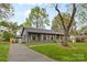 Charming home with a long driveway, detached garage, and well-kept lawn, perfect for suburban living at 7009 Wrentree Dr, Charlotte, NC 28210