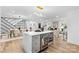 Modern kitchen with marble island, stainless steel appliances, and sleek lighting at 7009 Wrentree Dr, Charlotte, NC 28210