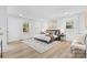 Serene bedroom with ample natural light, hardwood floors, and cozy decor at 7009 Wrentree Dr, Charlotte, NC 28210