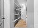A walk-in closet offering ample storage space with custom shelving at 7009 Wrentree Dr, Charlotte, NC 28210