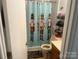 Cozy bathroom with decorative shower curtain and oak cabinetry at 7122 Pyramid Rd, Hickory, NC 28602