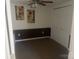Bedroom featuring neutral carpeting, wainscoting, and a ceiling fan at 7122 Pyramid Rd, Hickory, NC 28602