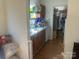 Kitchen with stainless steel sink, wood cabinets, tile backsplash, appliances and hardwood floors at 7122 Pyramid Rd, Hickory, NC 28602
