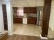 Basement kitchen with tile flooring, cherry cabinets, stainless steel appliances and light colored walls at 7122 Pyramid Rd, Hickory, NC 28602
