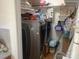 Laundry room featuring a gray washer and dryer next to wall shelving at 7122 Pyramid Rd, Hickory, NC 28602