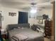 Main bedroom with ceiling fan, bed, dresser, and natural light at 7122 Pyramid Rd, Hickory, NC 28602