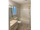 Well-lit bathroom with a vanity, toilet, and shower/tub combination at 7307 Meadowland Dr, Charlotte, NC 28215