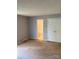 Bedroom featuring carpet floors, neutral walls, and a view to the adjoining bathroom at 7307 Meadowland Dr, Charlotte, NC 28215