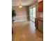 Dining area adjacent to kitchen featuring sliding glass doors to backyard at 7307 Meadowland Dr, Charlotte, NC 28215