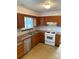 Efficient kitchen with stainless steel dishwasher and bright white subway tile backsplash at 7307 Meadowland Dr, Charlotte, NC 28215