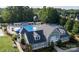 Aerial view of community pool, clubhouse, and surrounding homes at 7710 Epping Forest Dr, Huntersville, NC 28078