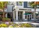 Exterior shot of a local Starbucks Coffee, with outdoor seating and pedestrian walkway at 7710 Epping Forest Dr, Huntersville, NC 28078