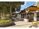A modern restaurant featuring an architectural roof and sleek outdoor seating is framed by lush landscaping at 7710 Epping Forest Dr, Huntersville, NC 28078
