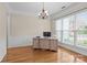 Home office space featuring a large window, hardwood floors, and trim work at 7710 Epping Forest Dr, Huntersville, NC 28078