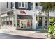 A quaint storefront features glass doors, inviting customers with a brightly lit, modern design at 7710 Epping Forest Dr, Huntersville, NC 28078