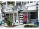 The storefront of a shopping boutique is designed with black and white awning and pillars at 7710 Epping Forest Dr, Huntersville, NC 28078