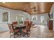 Bright sunroom featuring wood ceilings, neutral paint, and views of the backyard at 7710 Epping Forest Dr, Huntersville, NC 28078