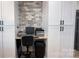 Functional home office with built-in desk, ample storage cabinets, and a comfortable workspace for productivity at 782 Chalice Sw St, Concord, NC 28027