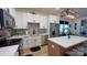 Modern kitchen features stainless steel appliances, white cabinets, granite countertops, and kitchen island with bar seating at 782 Chalice Sw St, Concord, NC 28027