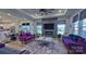 Open-concept living room boasts modern fireplace, TV, and access to the kitchen and dining area at 782 Chalice Sw St, Concord, NC 28027