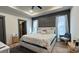 Spacious main bedroom with tray ceiling, decorative wall, and abundant natural light through large windows at 782 Chalice Sw St, Concord, NC 28027