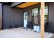 Charming front porch with seating, stylish decor, and a welcoming entrance with house number displayed at 782 Chalice Sw St, Concord, NC 28027
