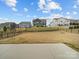 View of the backyard with a view of the neighborhood and beautiful sky at 9582 Creighton Nw Rd, Concord, NC 28027