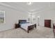 Bright bedroom with tray ceiling, carpeted floors, and lots of natural light at 9582 Creighton Nw Rd, Concord, NC 28027